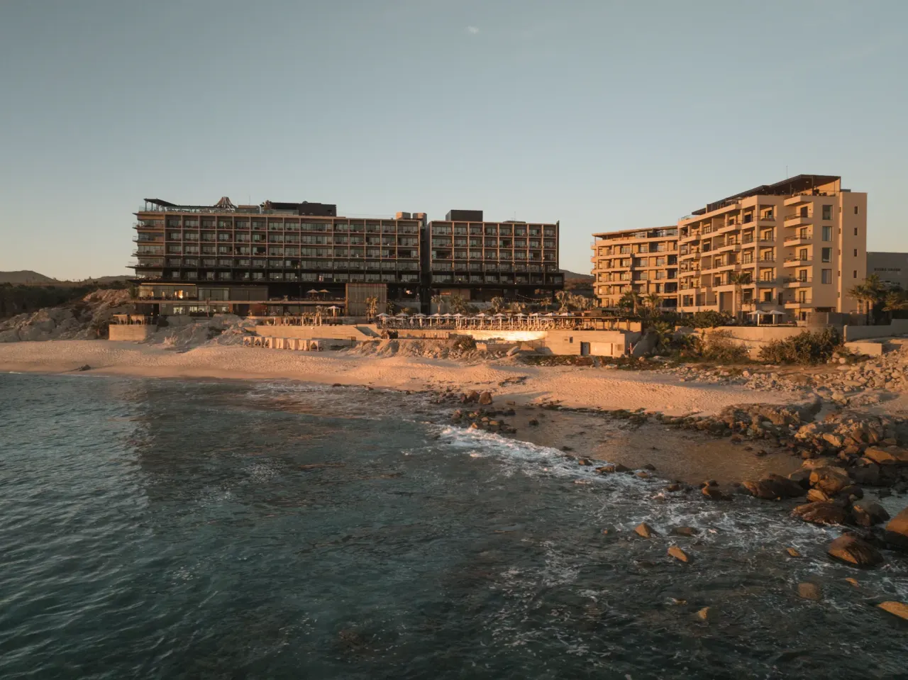 The Cape, a Thompson Hotel, on the beach in Los Cabos at dusk
