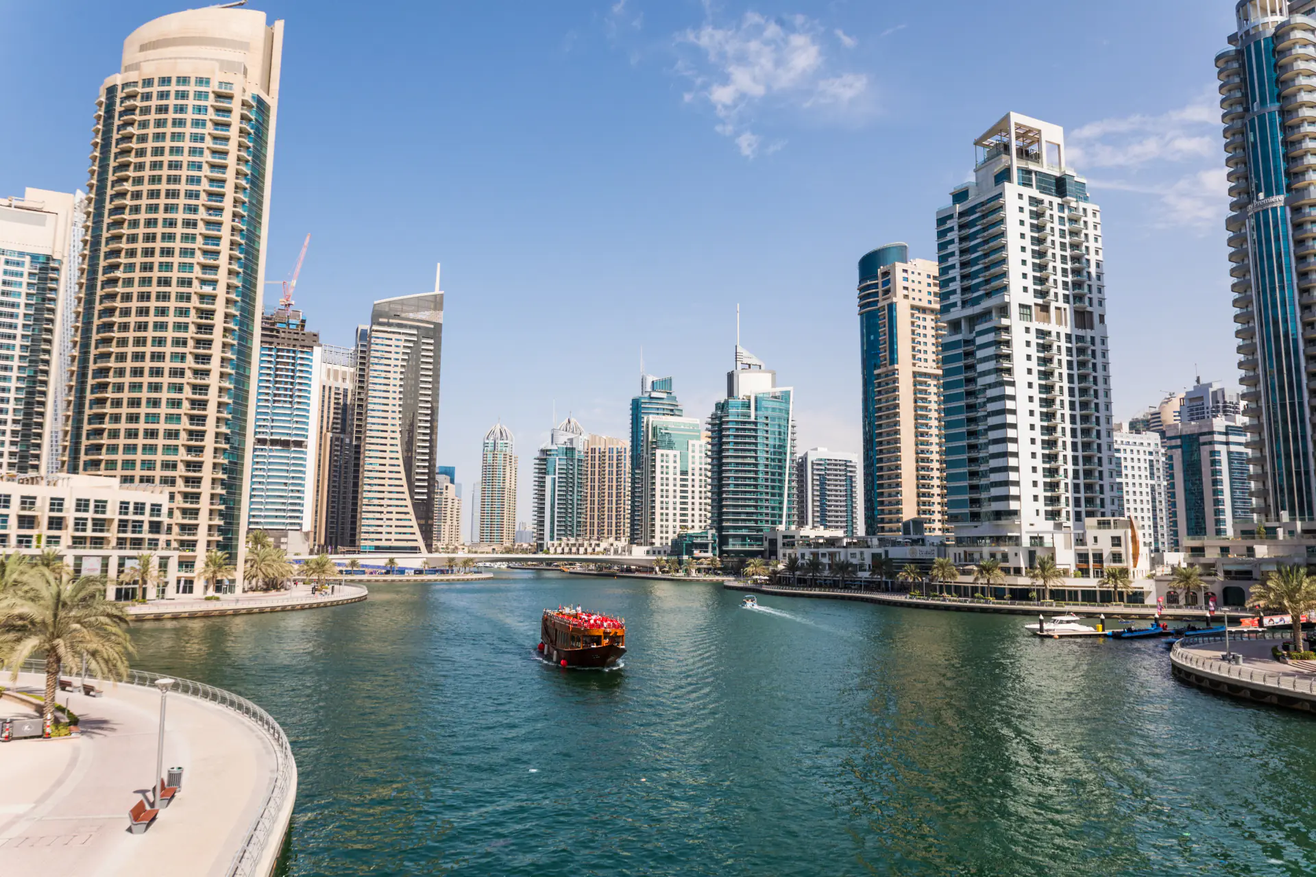 Dubai Marina canal with a dhow among the towers